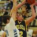 Chelsea's Luke Hollandsworth looks to shoot around Skyline's Peter Bakker during the first half at Skyline on Tuesday night.  Melanie Maxwell I AnnArbor.com